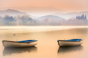 two white canoes near mountain at daytime, banyoles HD wallpaper