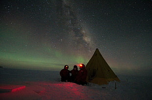 three person standing in front of tent wallpaper, sky, people, stars