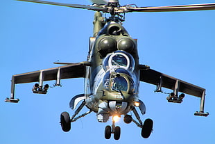 airborne Apache helicopter at daytime