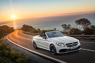 white Mercedes-Benz CLS coupe on road during sunset HD wallpaper