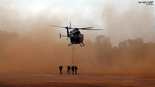 four soldier under black helicopter during daytime HD wallpaper