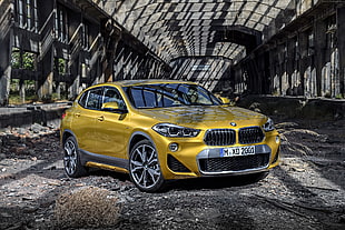 yellow BMW 5-door hatchback HD wallpaper