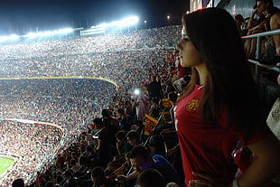 woman in red jersey shirt standing on soccer field HD wallpaper