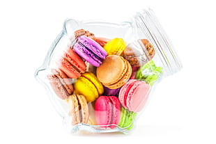 assorted color macaroons on clear glass jar