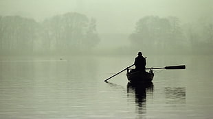 silhouette photography of man riding on canoe HD wallpaper