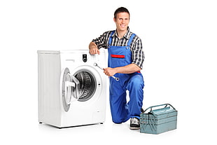 white front-load clothes dryer and a man holding combination wrench HD wallpaper