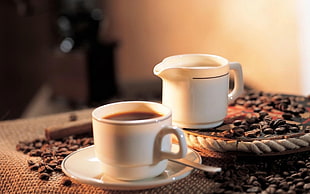 two white ceramic tea cups with coffee beans HD wallpaper
