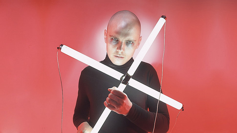 man holding LED lighted cross HD wallpaper