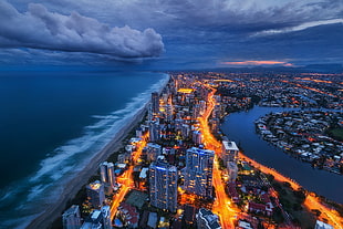 aerial photography of city scape, cityscape, skyline, sea, clouds HD wallpaper