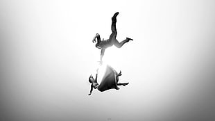 grayscale photo of man trying to catch girl falling from somewhere HD wallpaper