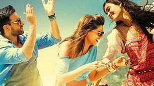 woman wearing blue crop top near man wearing blue dress shirt