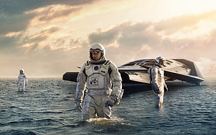 man in white astronaut suit walking on body of water HD wallpaper