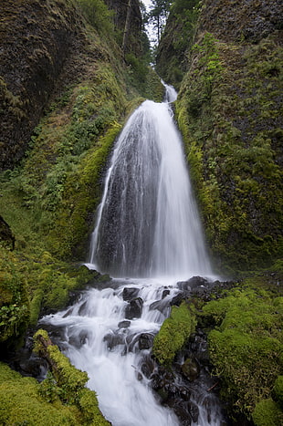 waterfalls in between rock formation HD wallpaper