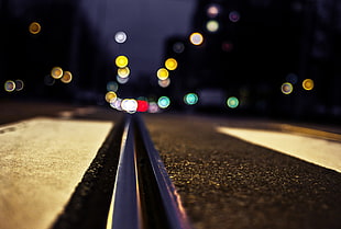 low angle photography of road with bokeh lights background HD wallpaper