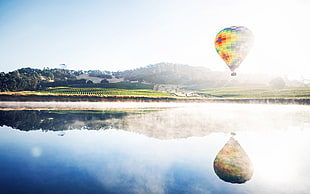 air balloon near to body of water HD wallpaper