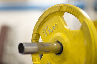 tilt shift lens photography of barbell plate