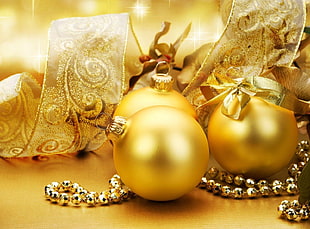 three gold baubles