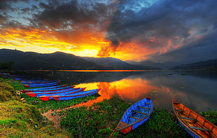 landscape photography of canoes near lake during sunset, phewa lake, pokhara, nepal HD wallpaper