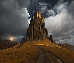 large rock mountain, storm, mountains, lightning, grass