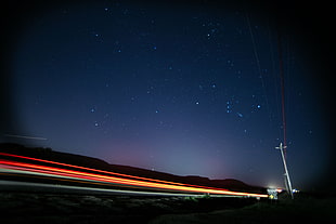 black and red car hood, lights, road, night sky, stars