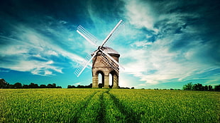 brown windmill on green grass field HD wallpaper