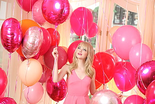 woman wearing pink tank top standing near pink balloons HD wallpaper