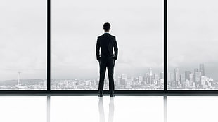 photography photo of man in suit-jacket outfit standing in front glass wall building HD wallpaper