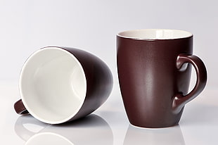 two brown-and-white ceramic mugs HD wallpaper