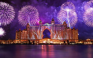 architectural photography high rise building during fireworks displau