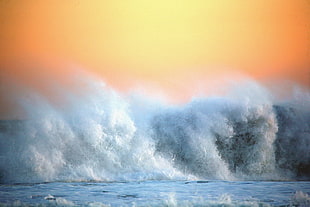 photography of wave and clouds