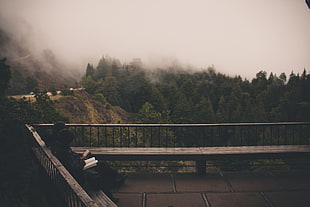 black and brown wooden table, vibes, trees, mist, forest