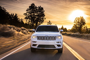 white Jeep vehicle on the gray pave road in golden hour photo HD wallpaper