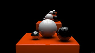 two black and one white balls on orange platform optical illusion HD wallpaper