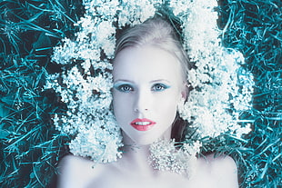 photography of woman lying white and green grasses