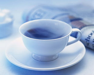 white tea cup with saucer