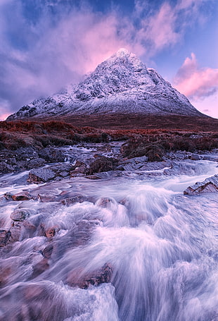 time lapse photography of river with overlooking mountain