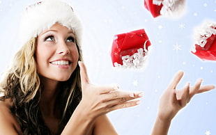 woman with santa hat throwing gift photo HD wallpaper