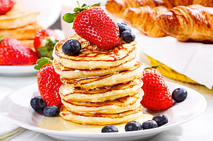 pile of pancakes with blueberries and strawberries HD wallpaper