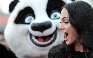 Angelina Jolie looking at Po mascot from Kung Fu Panda HD wallpaper