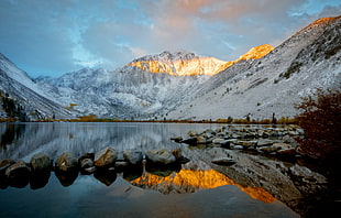 photography of mountain near river