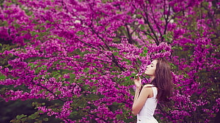 women's white sleeveless top, women outdoors, brunette, flowers, purple flowers HD wallpaper