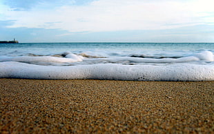 water Waves on shore during daytime