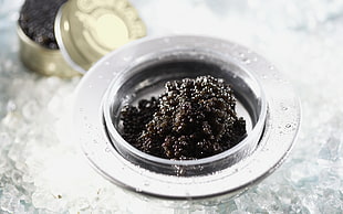 black granules on gray container