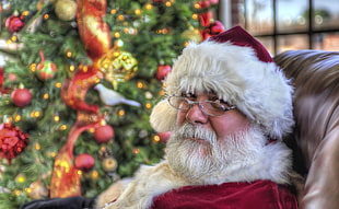 Santa Claus sitting on brown couch