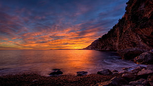 brown rock cliff, sunlight, coast, sky, clouds