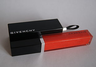 Givenchy glass bottle with box on top of white surface HD wallpaper