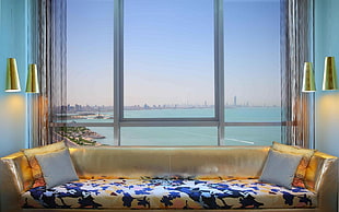 city can be seen through glass window at daytime HD wallpaper