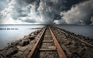 brown metal train rail, clouds, railway, sea HD wallpaper