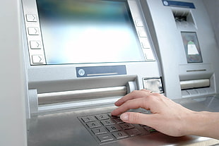 person using gray ATM HD wallpaper