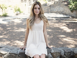 woman wearing scoop neck sleeveless dress